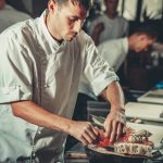 Busy chef at work in the restaurant kitchen