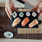 hands cooking sushi